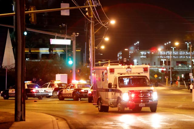 An ambulance leaves the concert venue after a mass shooting at a music festival on the Las Vegas Strip