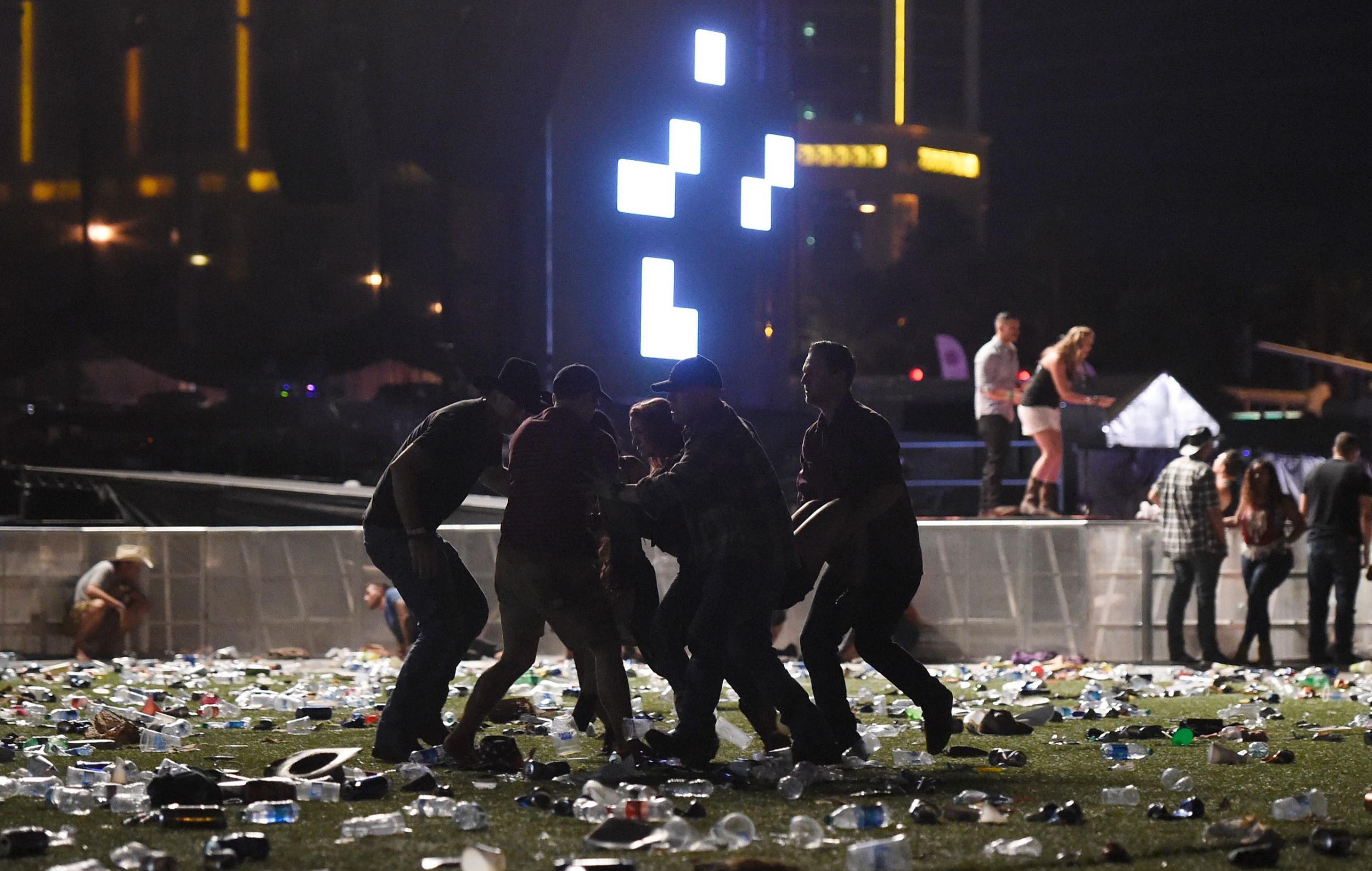 People carry an injured person at the Route 91 Harvest country music festival (Getty Images)
