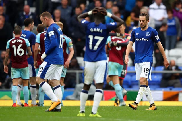 Everton's players look on after defeat by Burnley