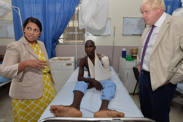 Minister Priti Patel and Foreign Secretary Boris Johnson on a visit to human trafficking victims in Nigeria