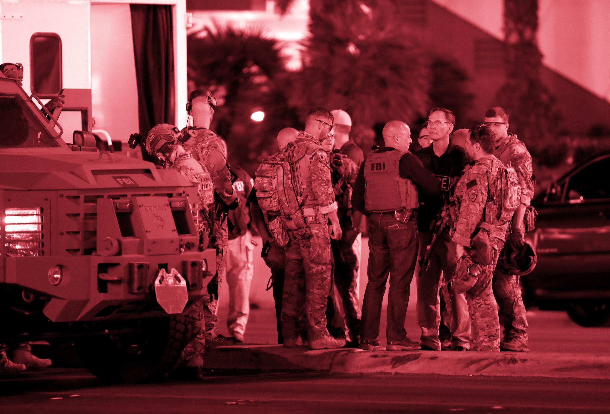 FBI agents confer in front of the Tropicana hotel-casino on October 2, 2017, after a mass shooting during a music festival on the Las Vegas Strip in Las Vegas, Nevada