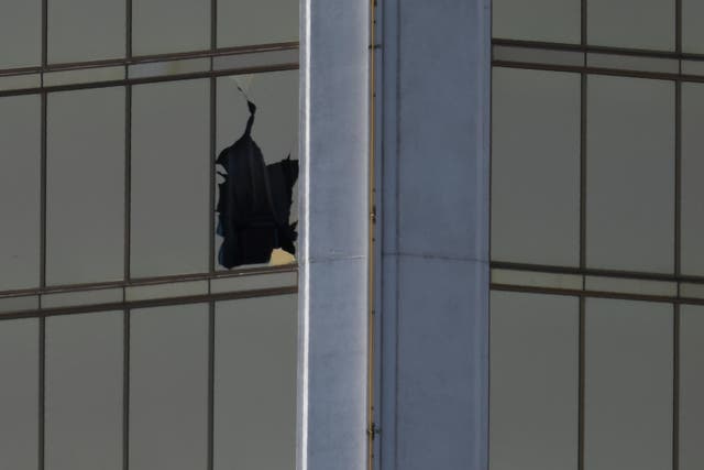 A broken window is seen at The Mandalay Bay Resort and Casino following a mass shooting at the Route 91 Festival in Las Vegas, Nevada, U.S., October 2, 2017