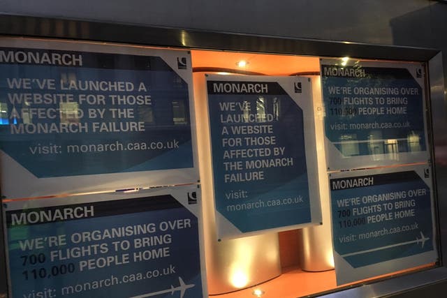 Plane talk: Posters about the Monarch collapse in the window of the CAA headquarters in central London