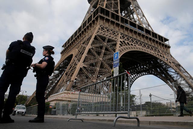 French police patrol near the Eiffel Tower as part of heightened security measures in Paris
