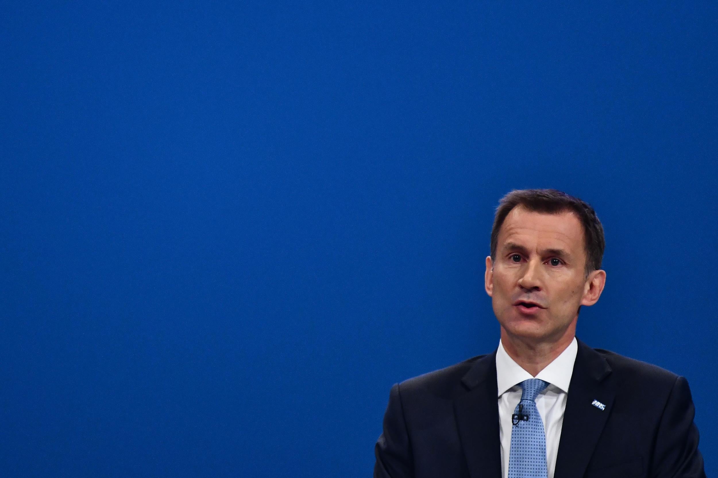Britain's Health Secretary Jeremy Hunt delivers his speech on the third day of the Conservative Party annual conference at the Manchester Central Convention Centre in Manchester