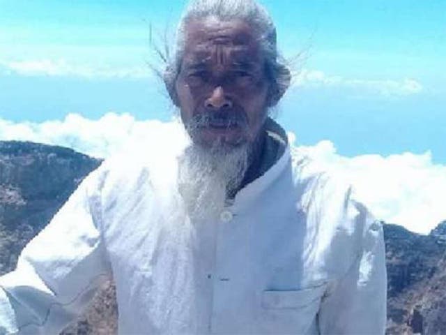 Mangku Mokok pictured at the summit of Mount Agung