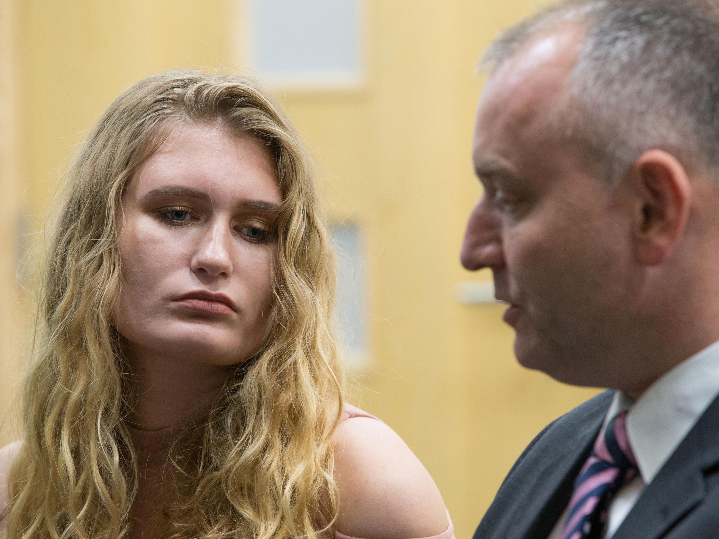 Husband Peter Wilkinson, who survived the attack, and daughter Lydia, hold hands as they speak at Lloyd House in Birmingham about their loss