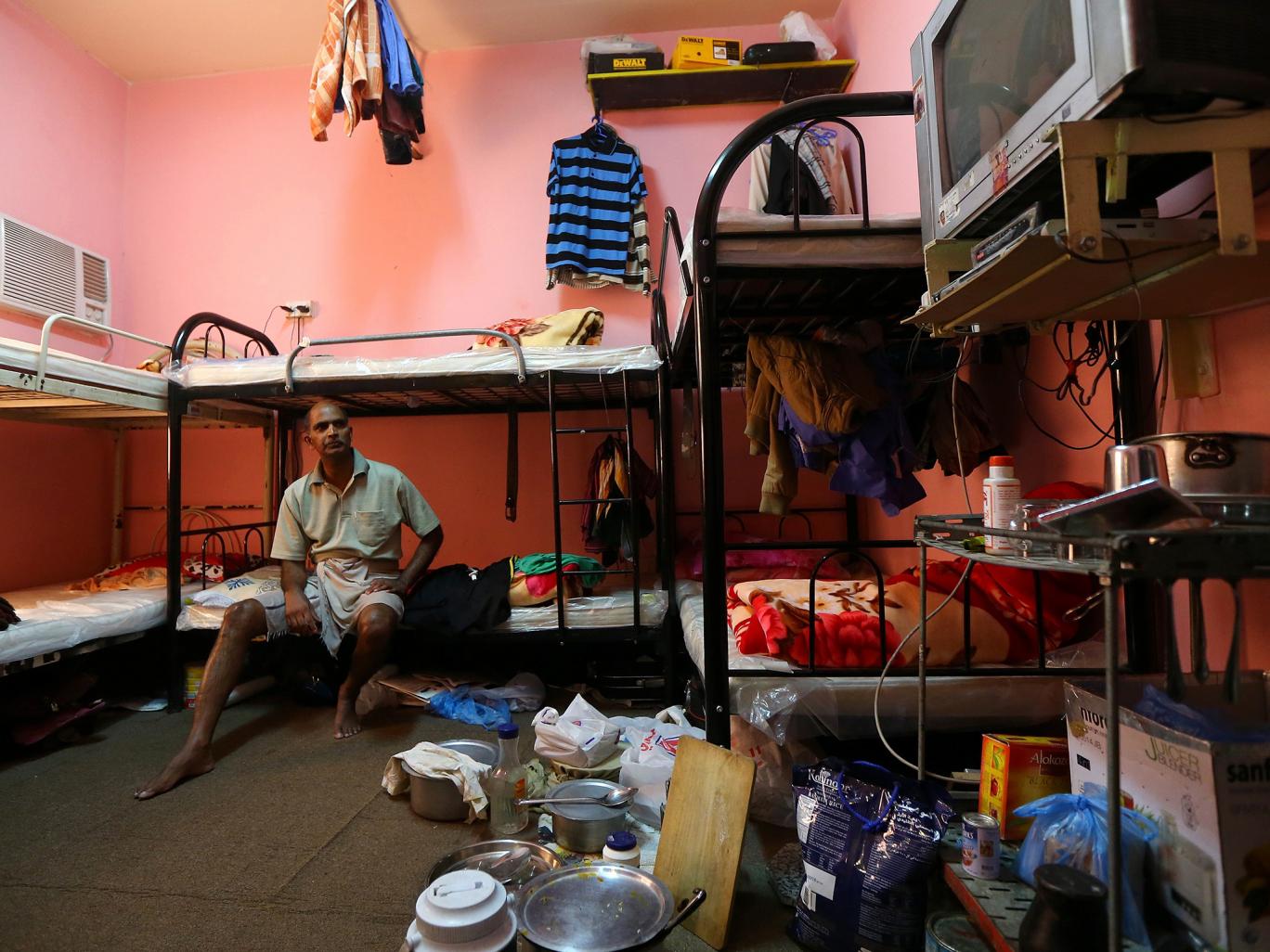 A Qatar worker in his shared accommodation