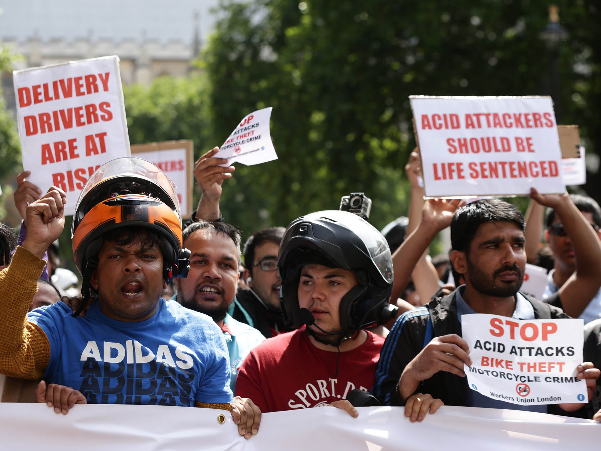 Delivery riders demonstrate in Parliament Square after five separate victims were targeted by two moped-riding acid attackers