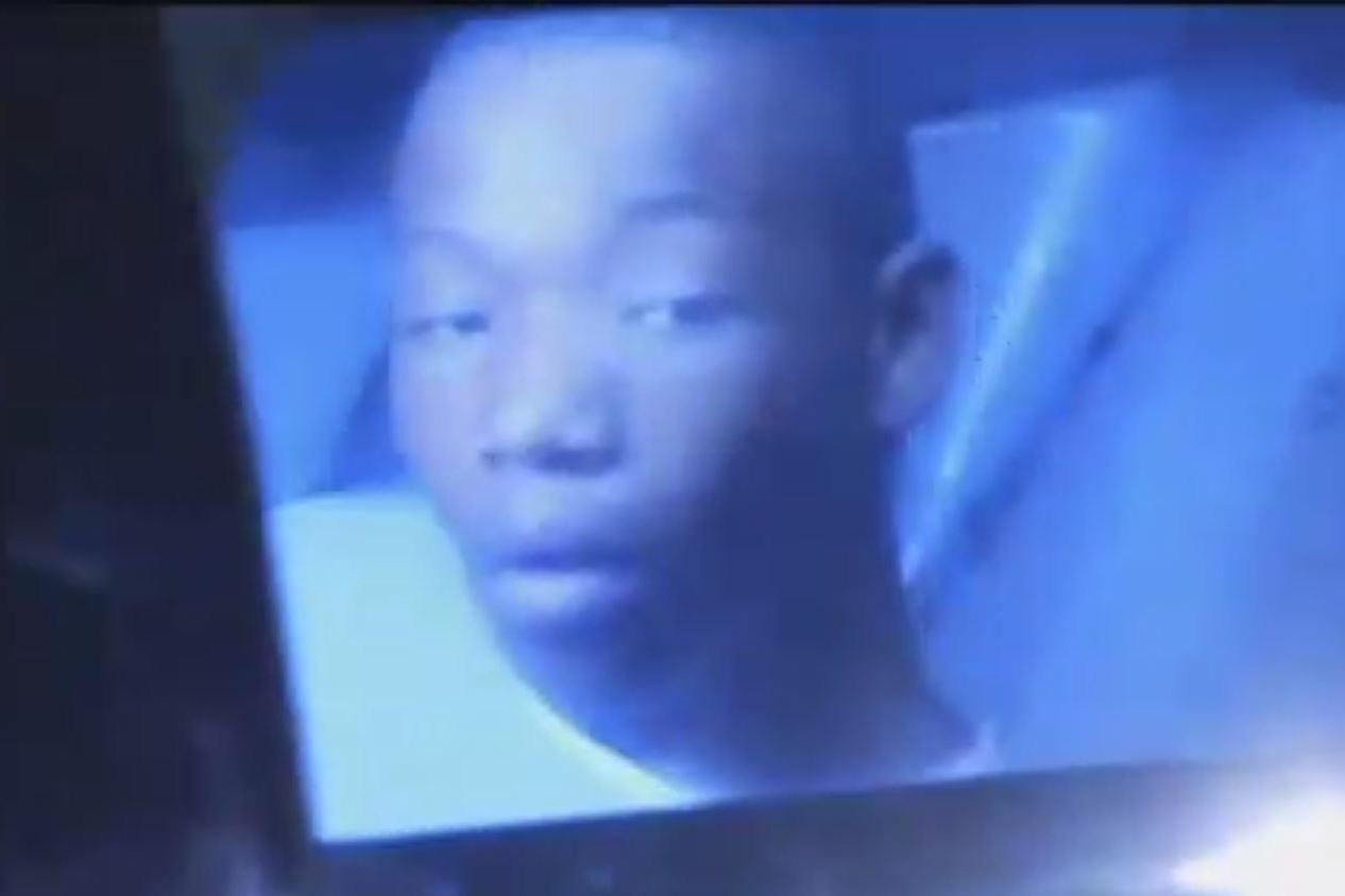 Deonte Green in the back of a police car after his arrest