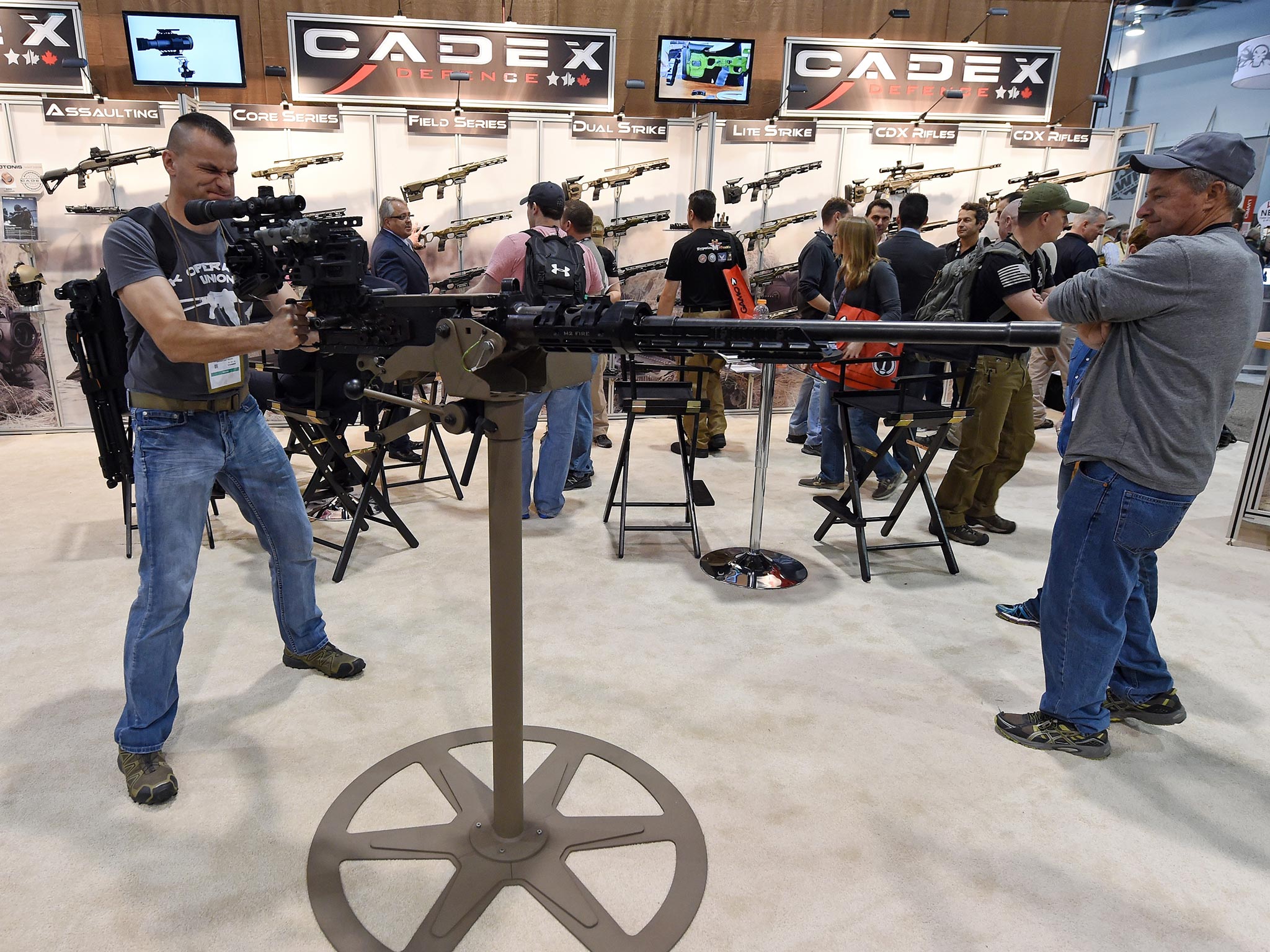 Visitors test weapons at the annual SHOT trade show