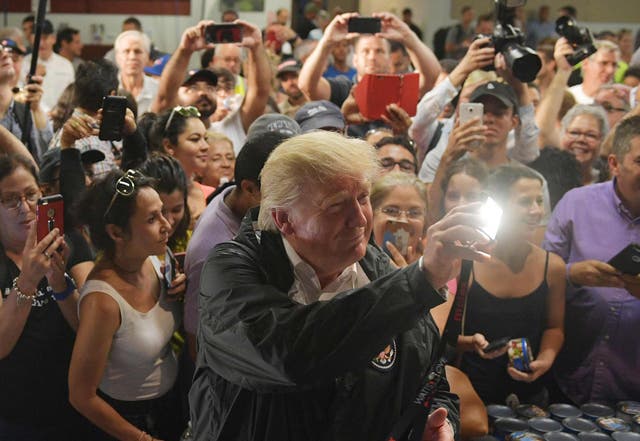 President Donald Trump takes part in a food and supply distribution at the Cavalry Chapel in Guaynabo, Puerto Rico