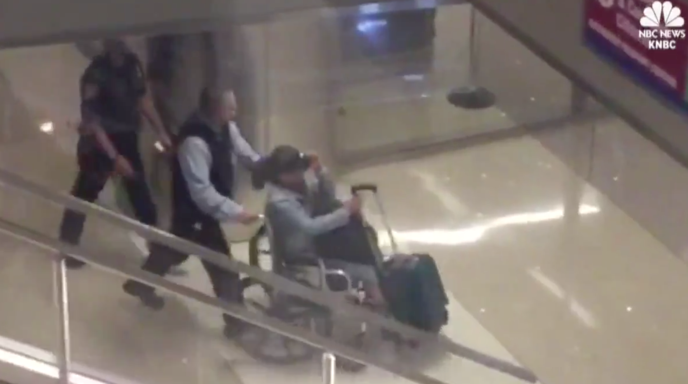 Marilou Danley was whisked past waiting media in a wheelchair