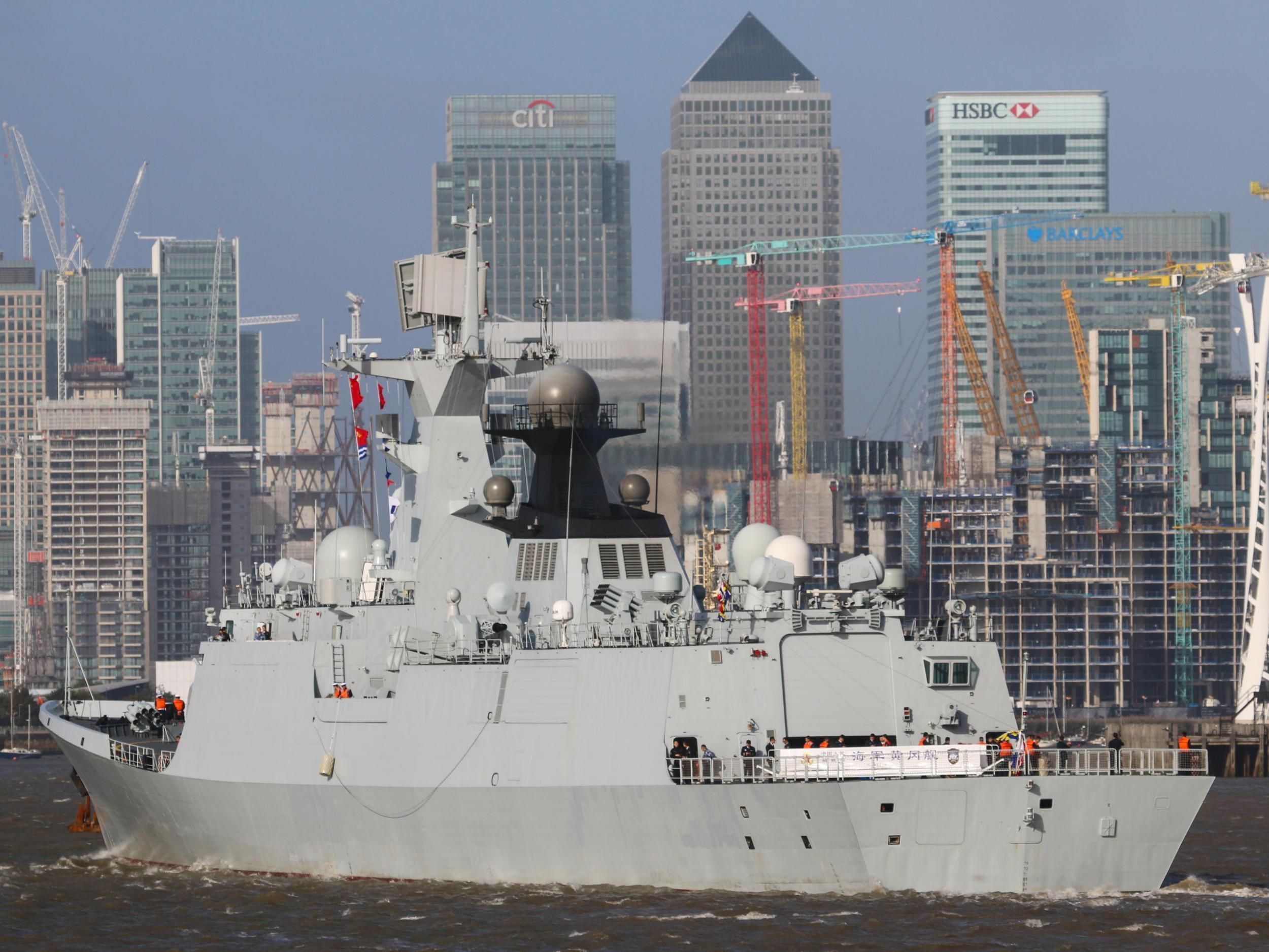 Chinese navy ship Huanggang on the Thames approaching Canary Wharf