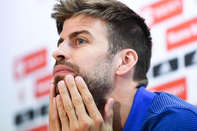 Gerard PIque speaks to the press while on Spain duty