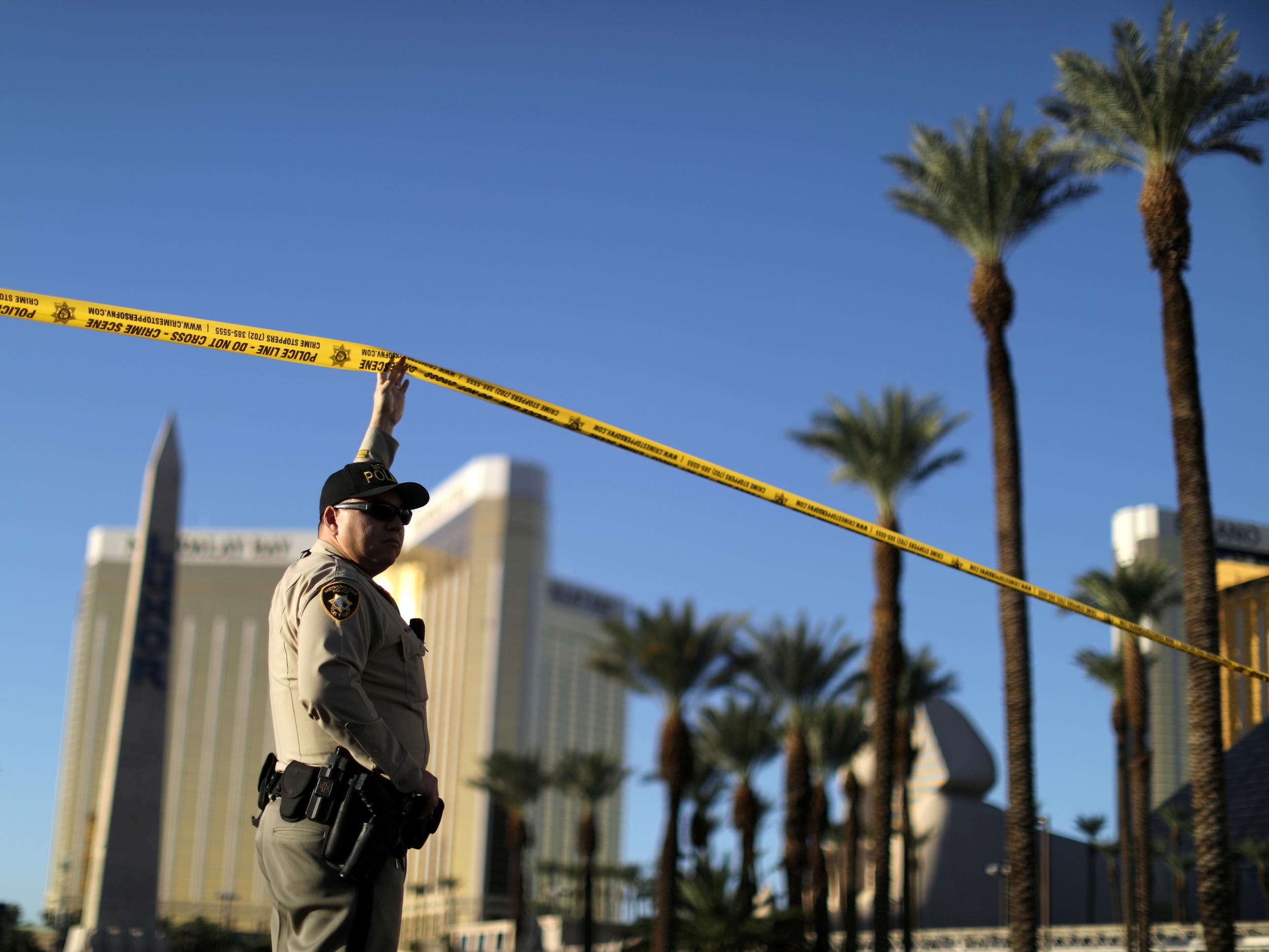 A police officer stands in front of the Route 91 music festival site where the mass shooting took place