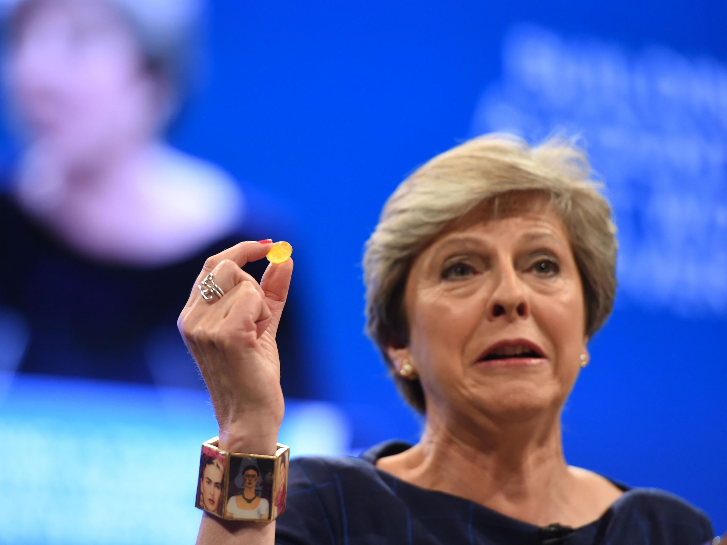 Theresa May hold's the Chancellor's cough sweet, which didn't do her much good