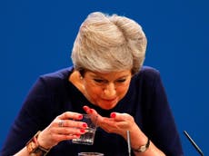 May’s conference speech interrupted with several minutes of coughing