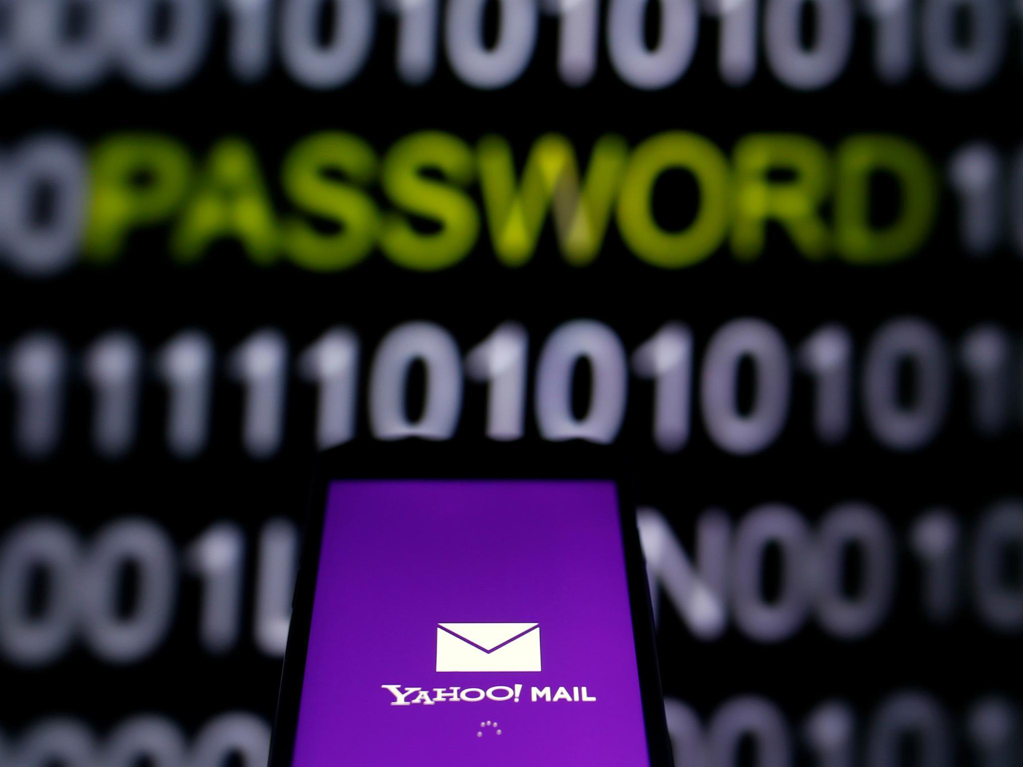 Yahoo Mail logo is displayed on a smartphone's screen in front of a code in this illustration taken in October 6, 2016