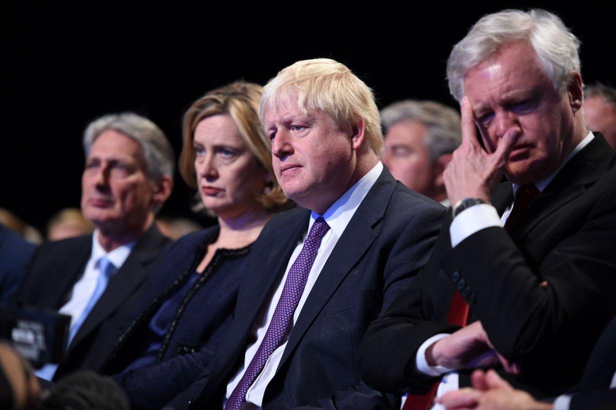 Mr Johnston listening to the Prime Minister’s conference speech on Wednesday (Getty)