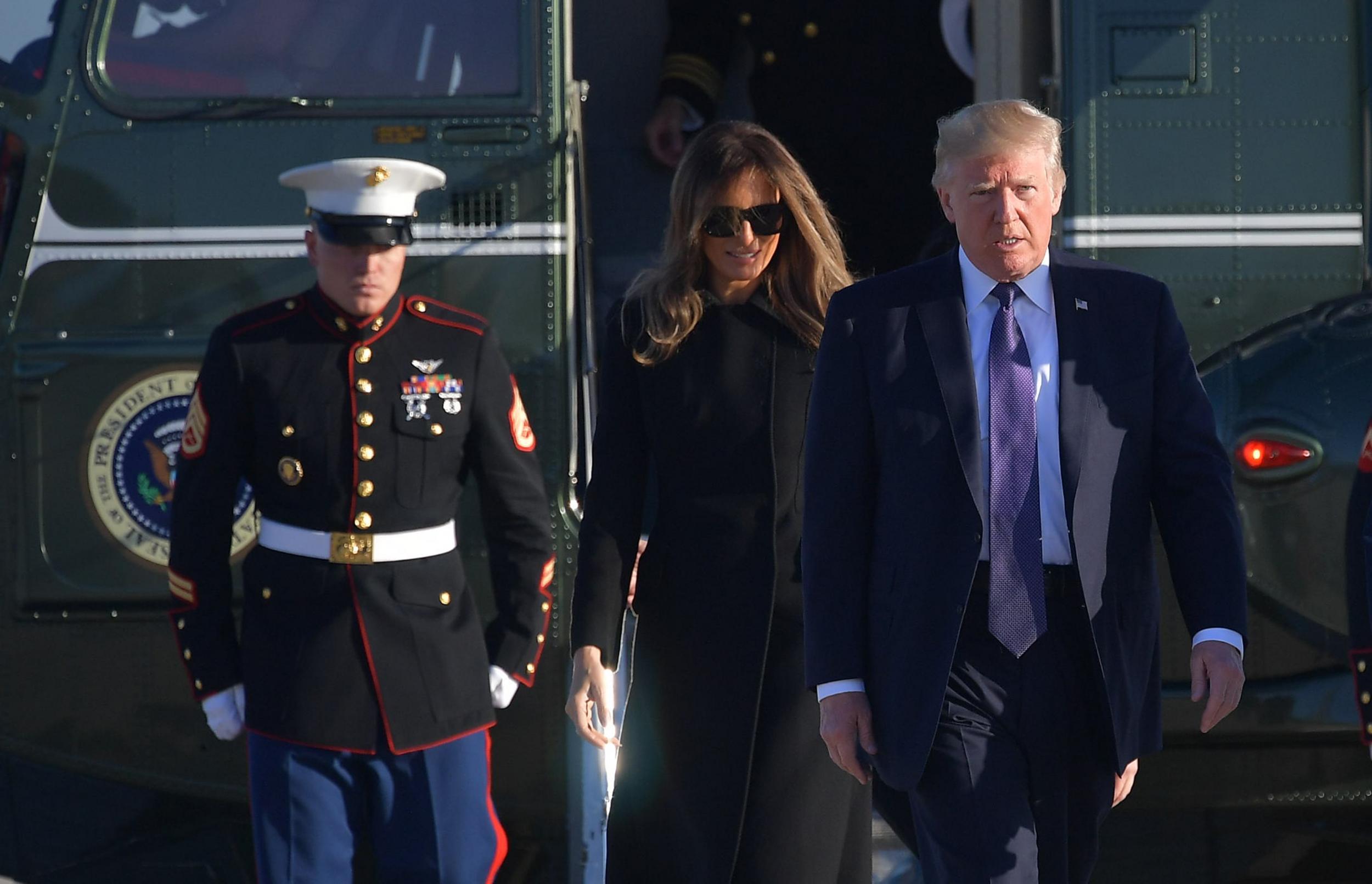 Donald Trump and Melania Trump make their way to board Air Force One before departing for Las Vegas