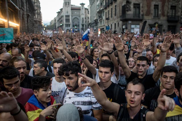Thousands protested in Barcelona against the violence that marred Sunday’s referendum vote