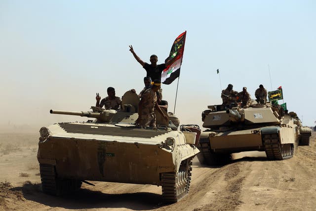 Iraqi forces and fighters from the Popular Mobilisation Units advance towards Isis’ stronghold of Hawija 