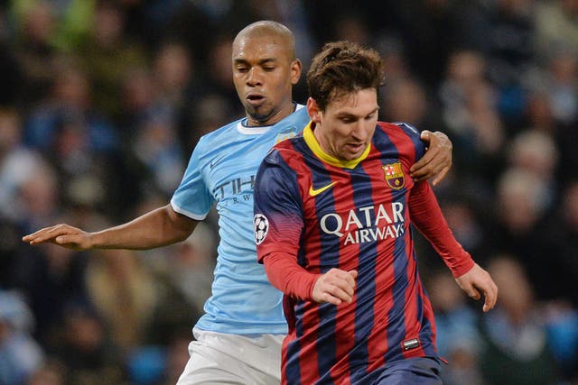 Lionel Messi and Fernandinho go head to head at the Etihad in 2014