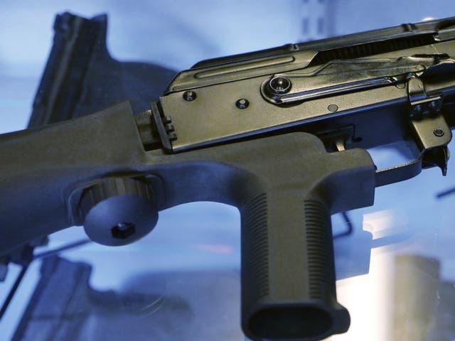 A bump stock attached to a semi-automatic rifle at a store and shooting range in Utah