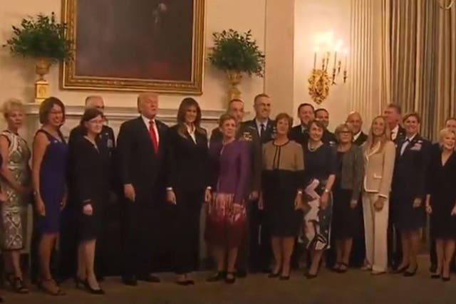 Donald Trump standing for photos with top US military leaders before White House dinner