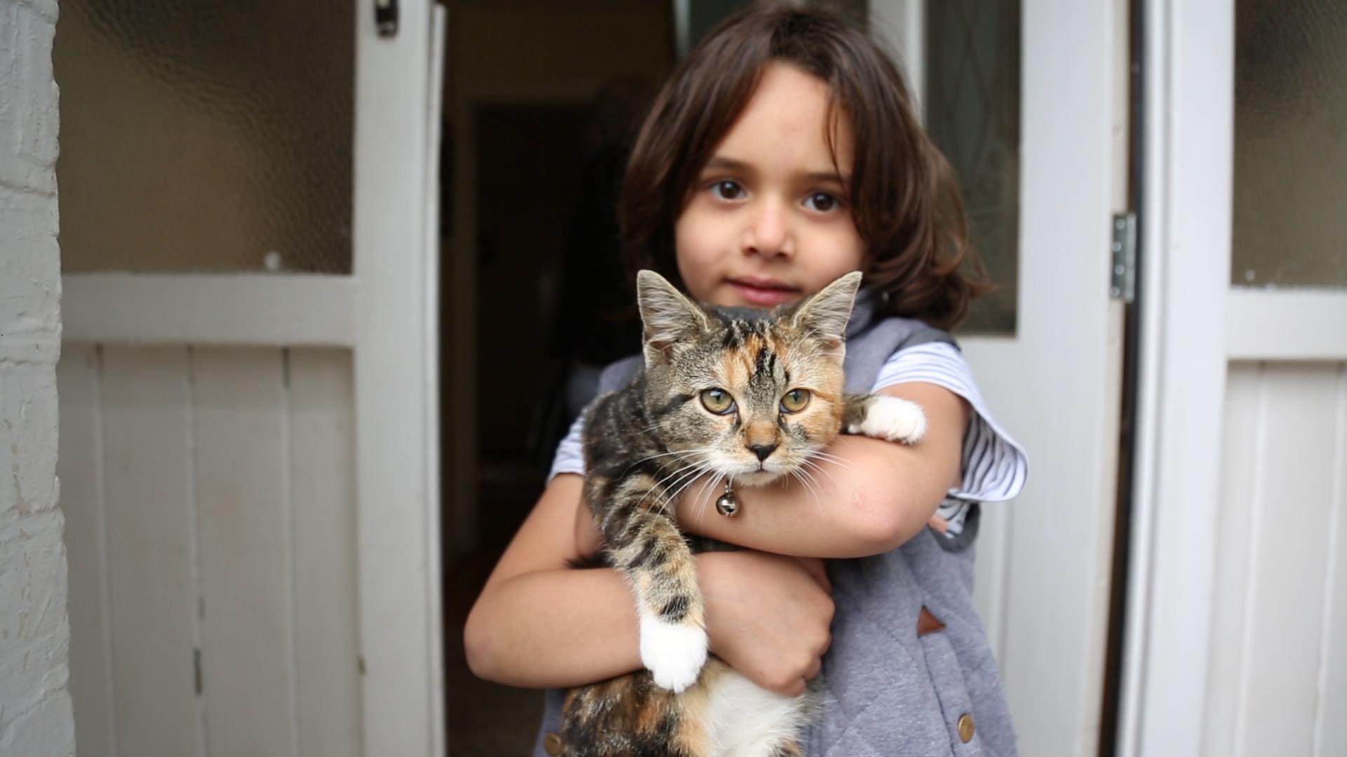 Seven-year-old Yazan and the family cat