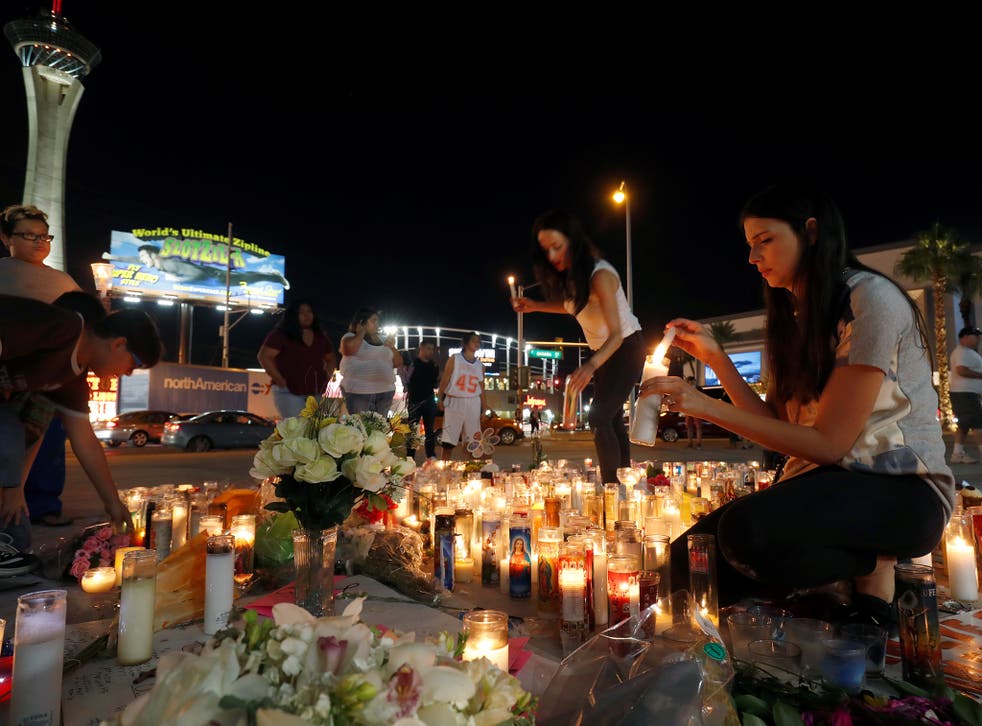 Candles at a makeshift memorial for shooting victims at the Las Vegas Strip