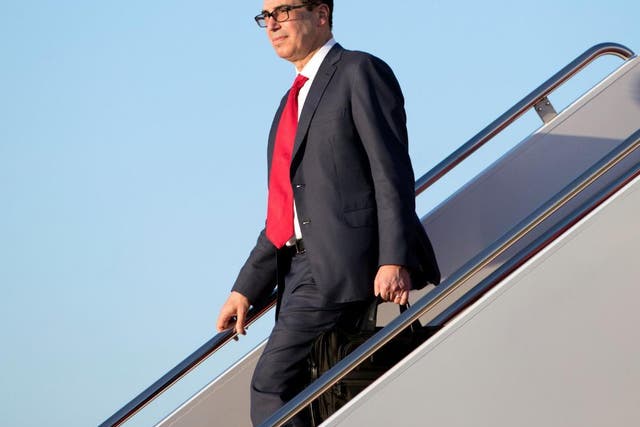 Treasury Secretary Steven Mnuchin descending from Air Force One last month. One of his round-trip flights from Washington to New York cost $15,000