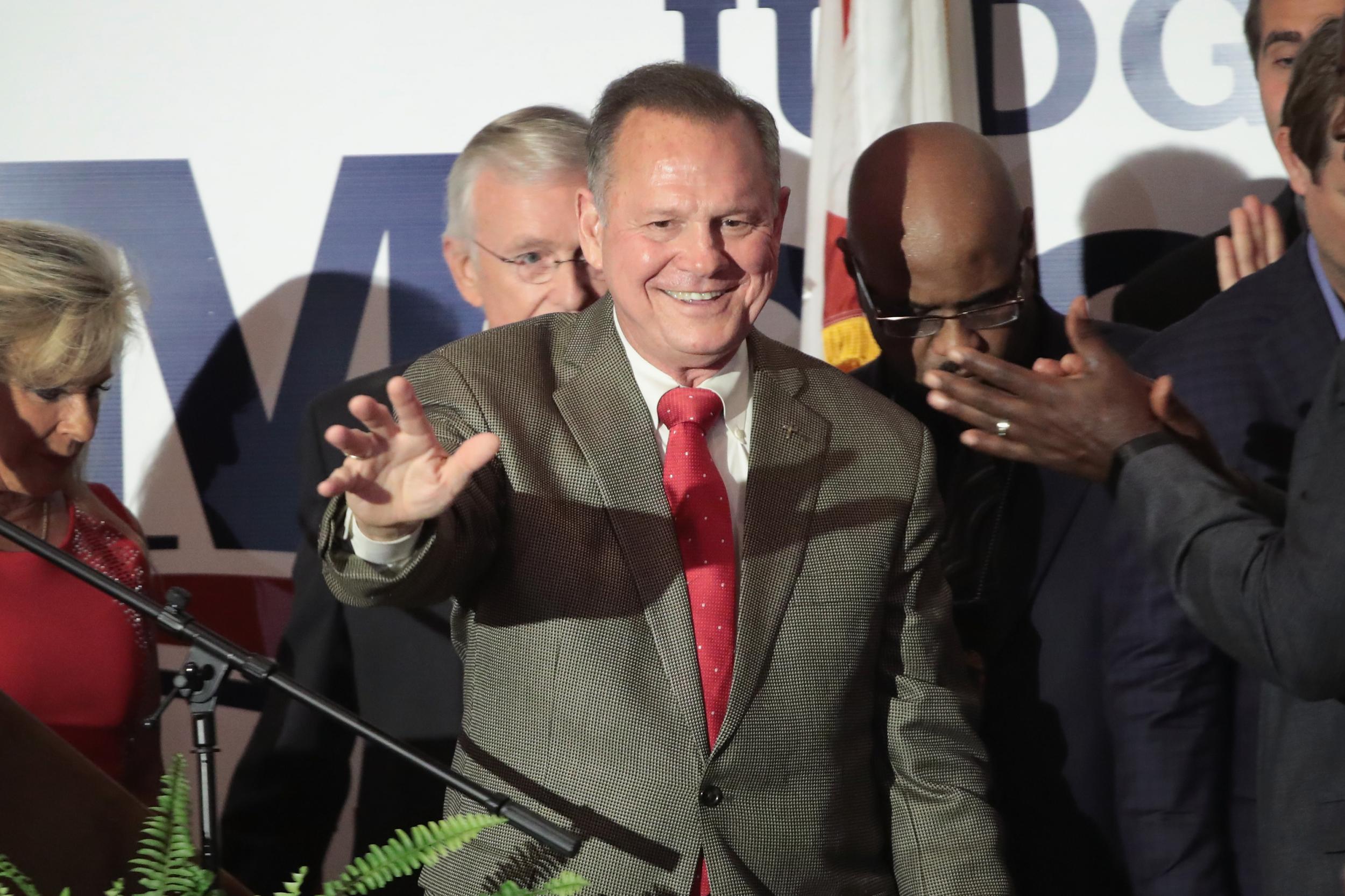 Roy Moore greets supporters at an election-night rally on September 26 in Montgomery, Alabama