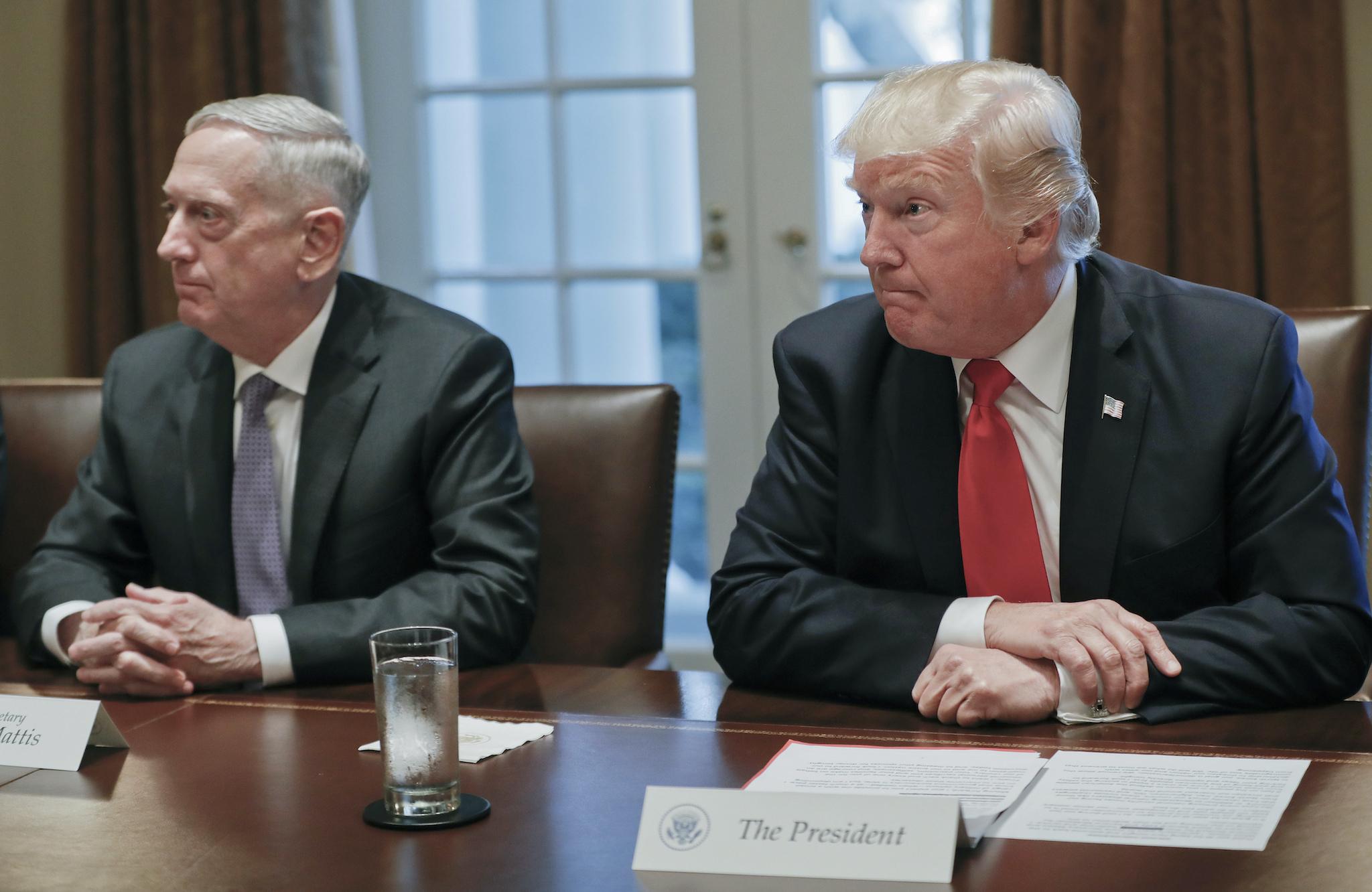 President Donald Trump during a briefing with Senior Military leaders. Sitting on the left is Defence Secretary James Mattis.