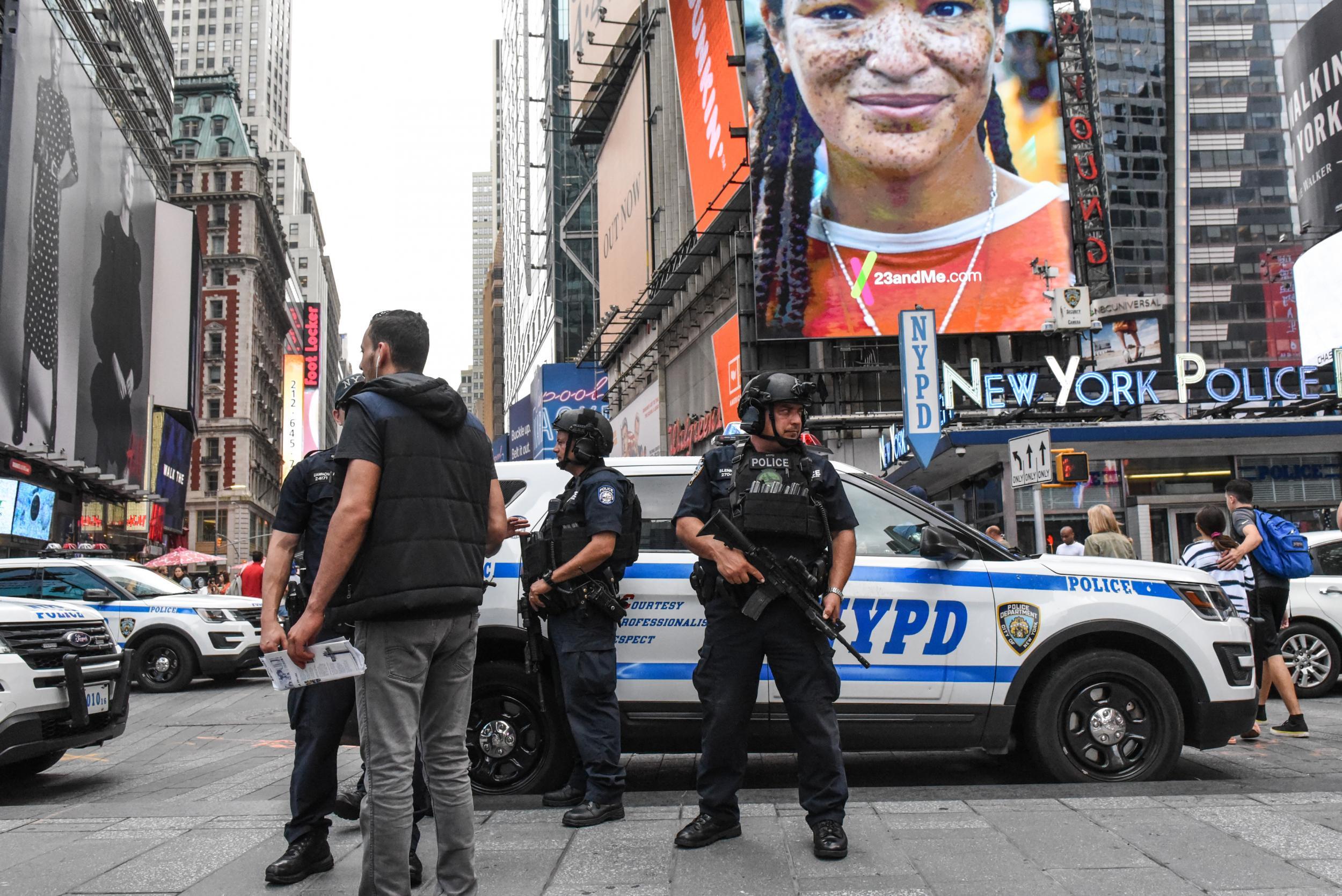 Members of the New York City Police Counterterrorism force stand guard in Times Square