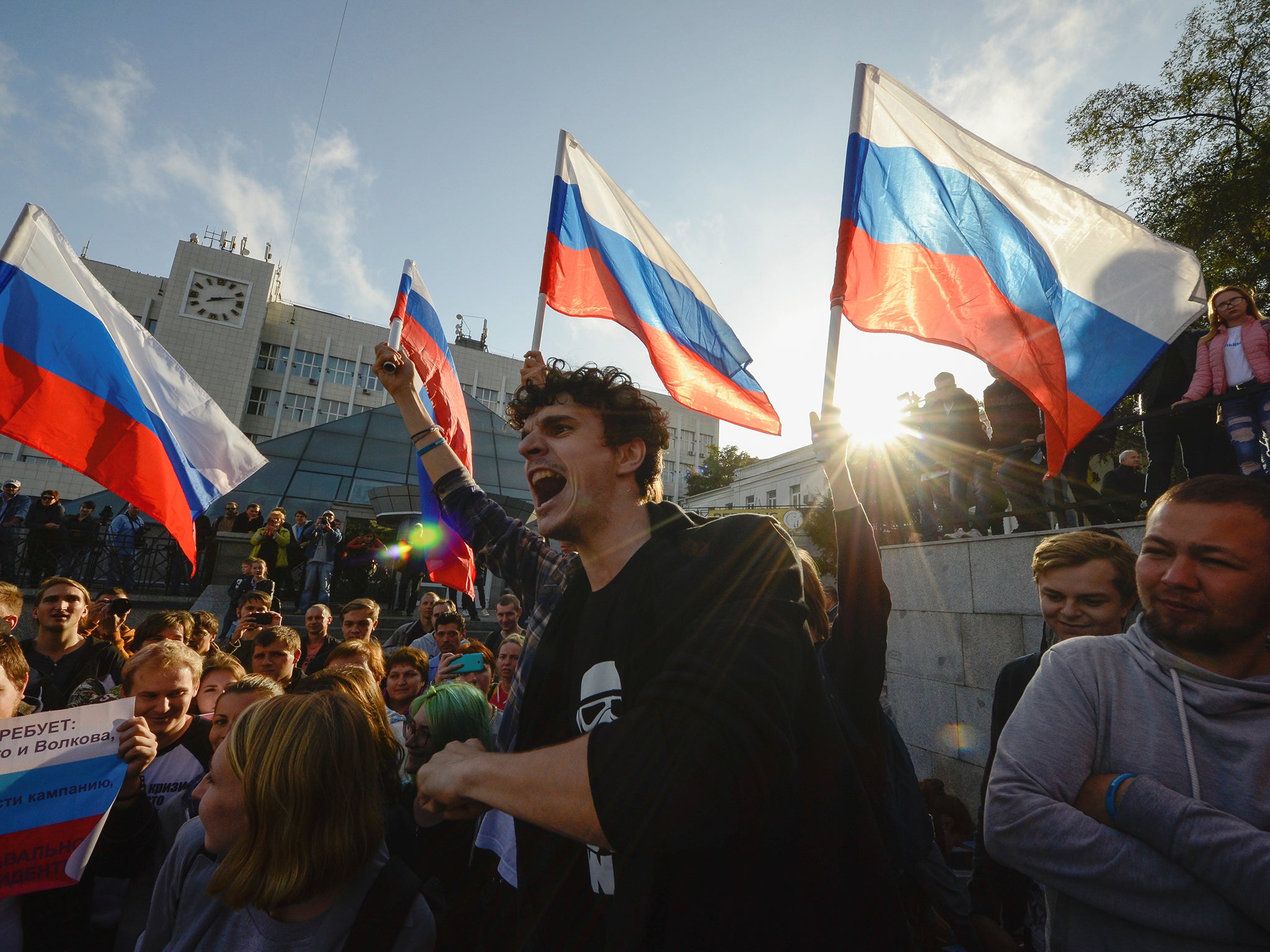 Supporters of Russian opposition leader Alexei Navalny attend a rally in Vladivostok, Russia