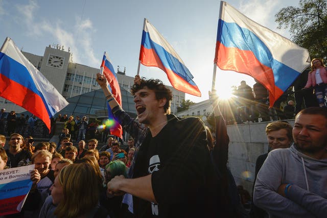 Supporters of Russian opposition leader Alexei Navalny attend a rally in Vladivostok, Russia