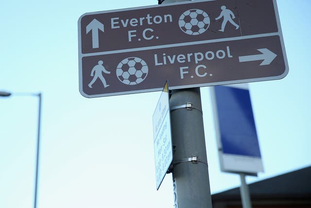 Road signs show geometrically-impossible footballs