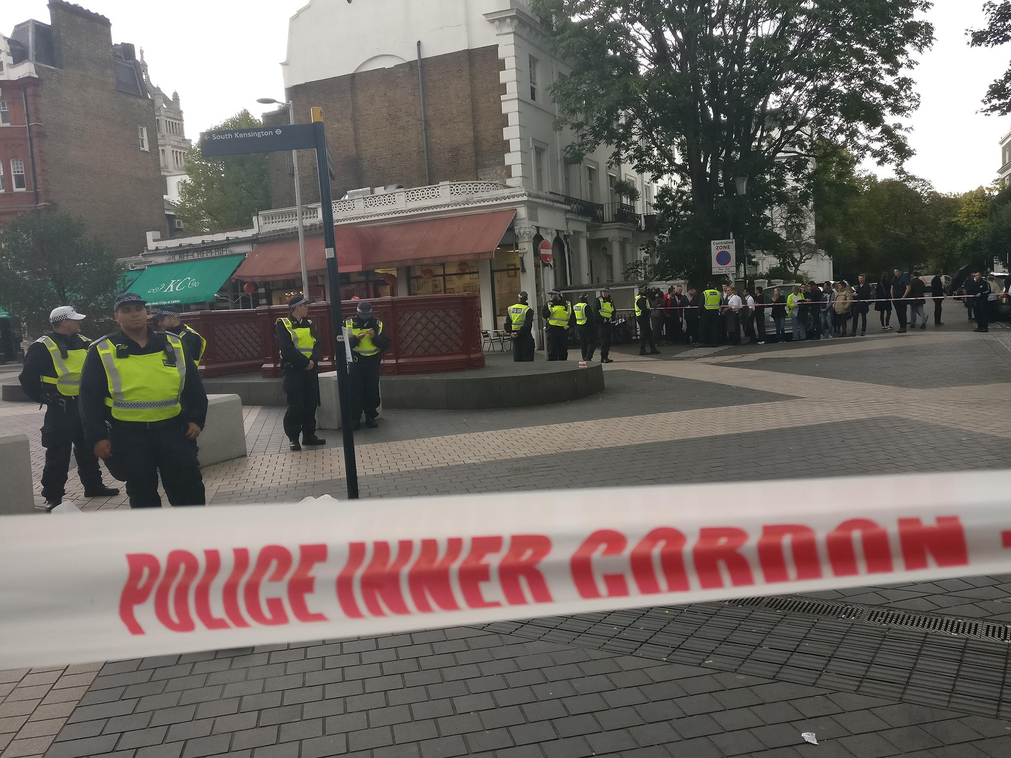 Police stand guard in Exhibition Road, South Kensington, after a car crash left pedestrians injured on 7 October