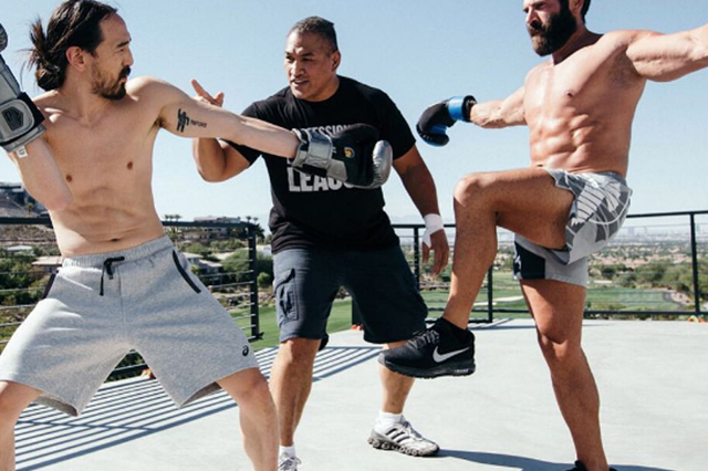 Dan Bilzerian (right), shown here pursuing his passion for martial arts, has not replied to threats