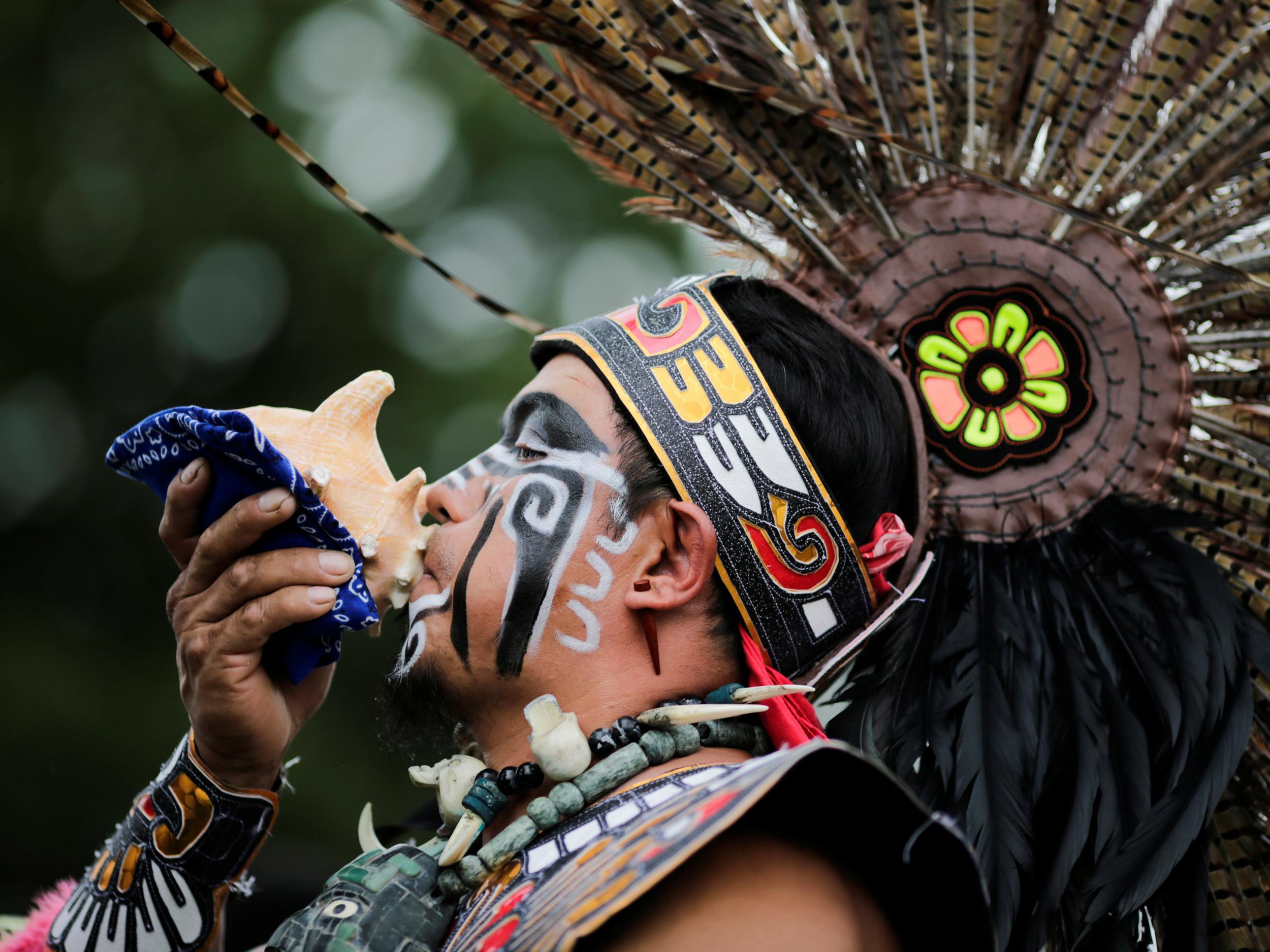 A reveler performs during a "pow-wow" celebrating the Indigenous Peoples' Day Festival in Randalls Island in New York on 8 October 2017