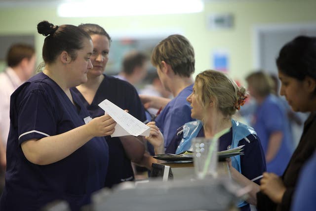 Nurses work during a busy shift in an A&E department