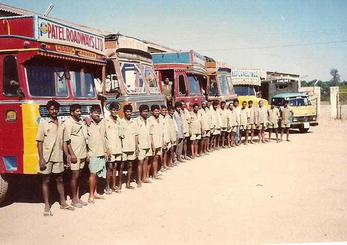 Workers with Patel Roadways trucks