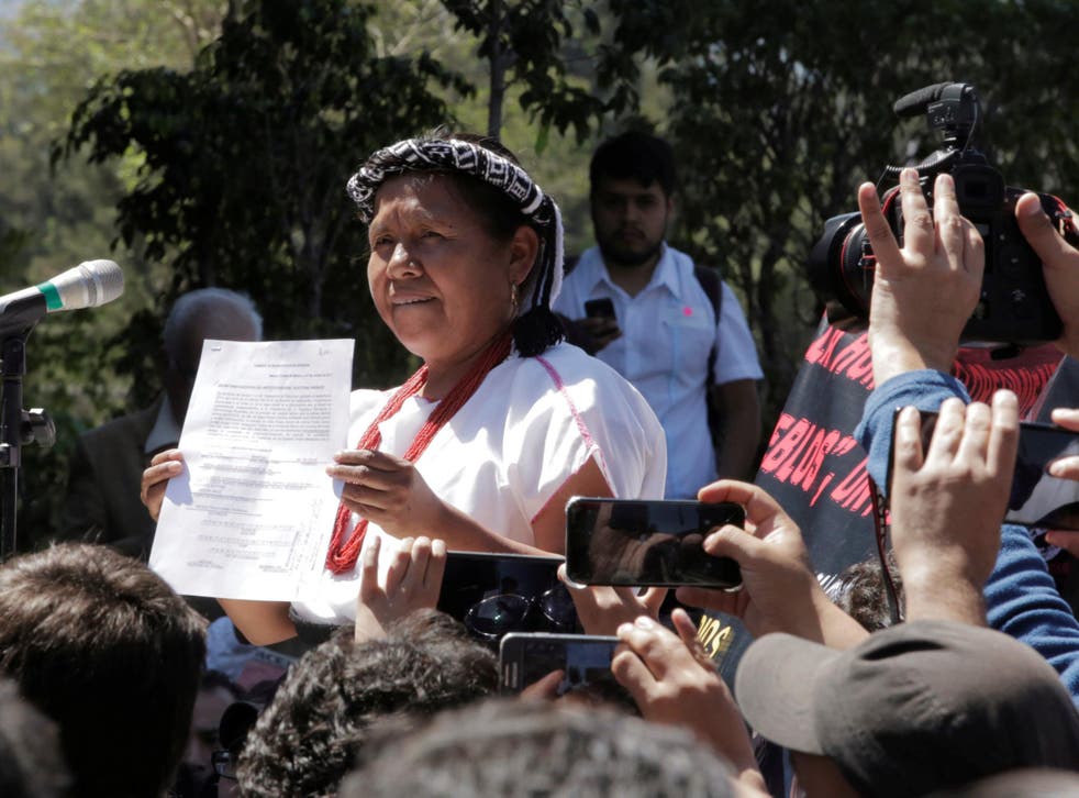 Maria de Jesus Patricio Martinez holds a document after registering to run in Mexico's presidential election