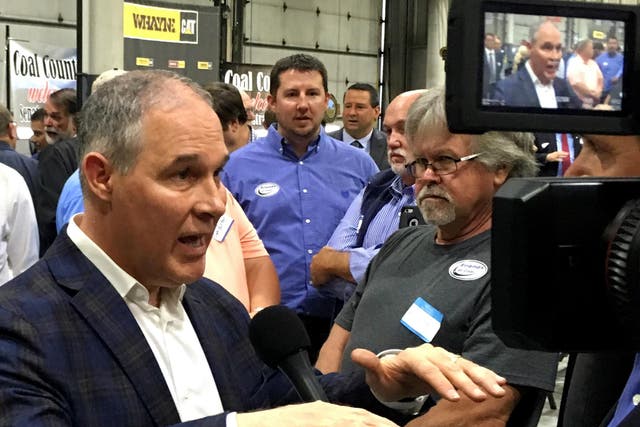 Scott Pruitt talking to reporters. He is said to have been targeted by fellow passengers angry at his attempts to reverse Obama-era climate policies