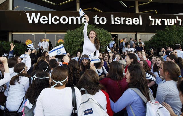 Israelis welcome new Jewish immigrants from North America upon their arrival at Ben Gurion International Airport near Tel Aviv in this file photo