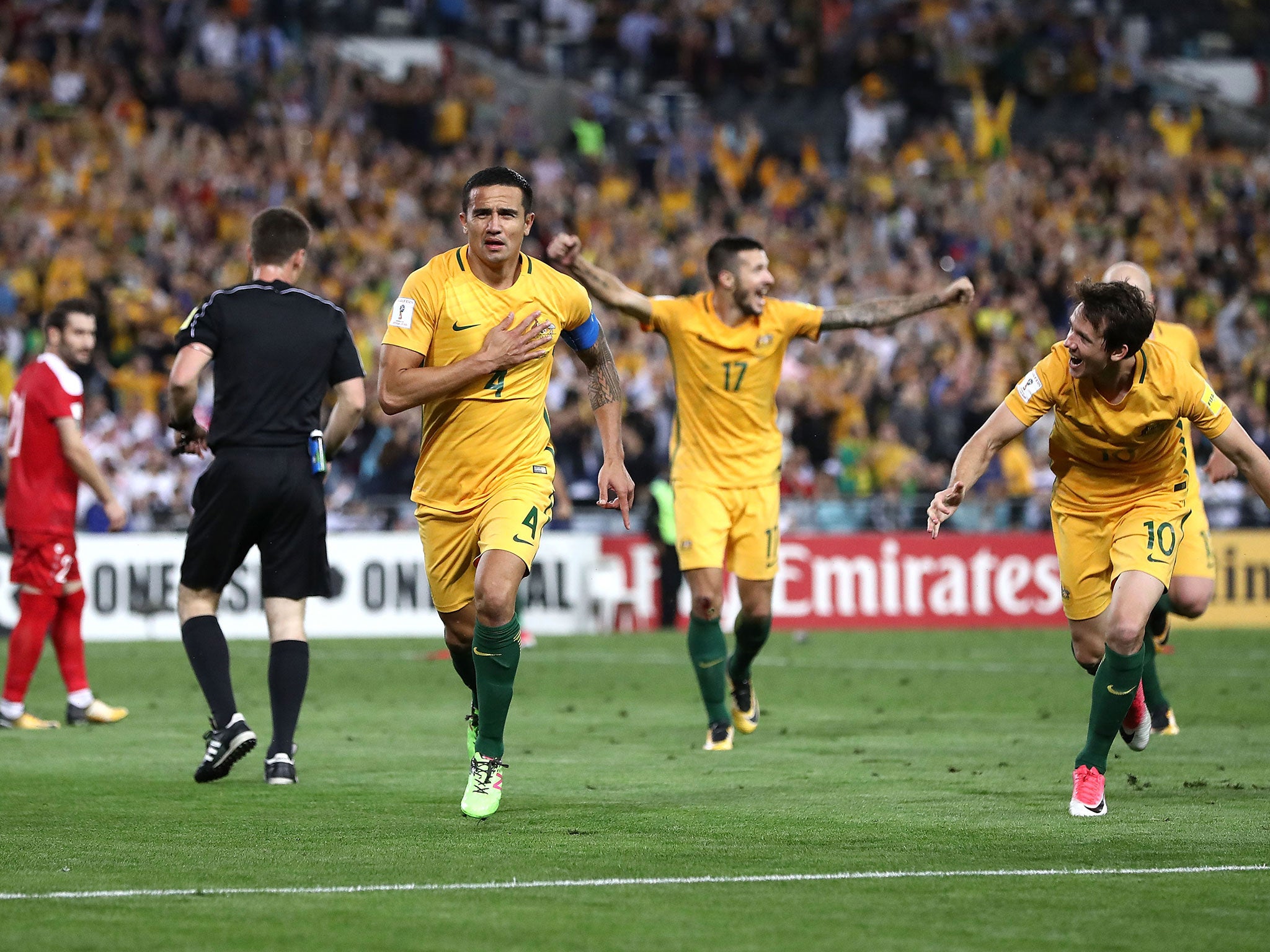 Tim Cahill celebrates securing the winning goal against Syria