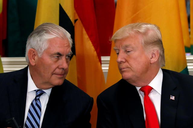 US Secretary of State Rex Tillerson and President Donald Trump confer during a working lunch with African leaders during the UN General Assembly in September