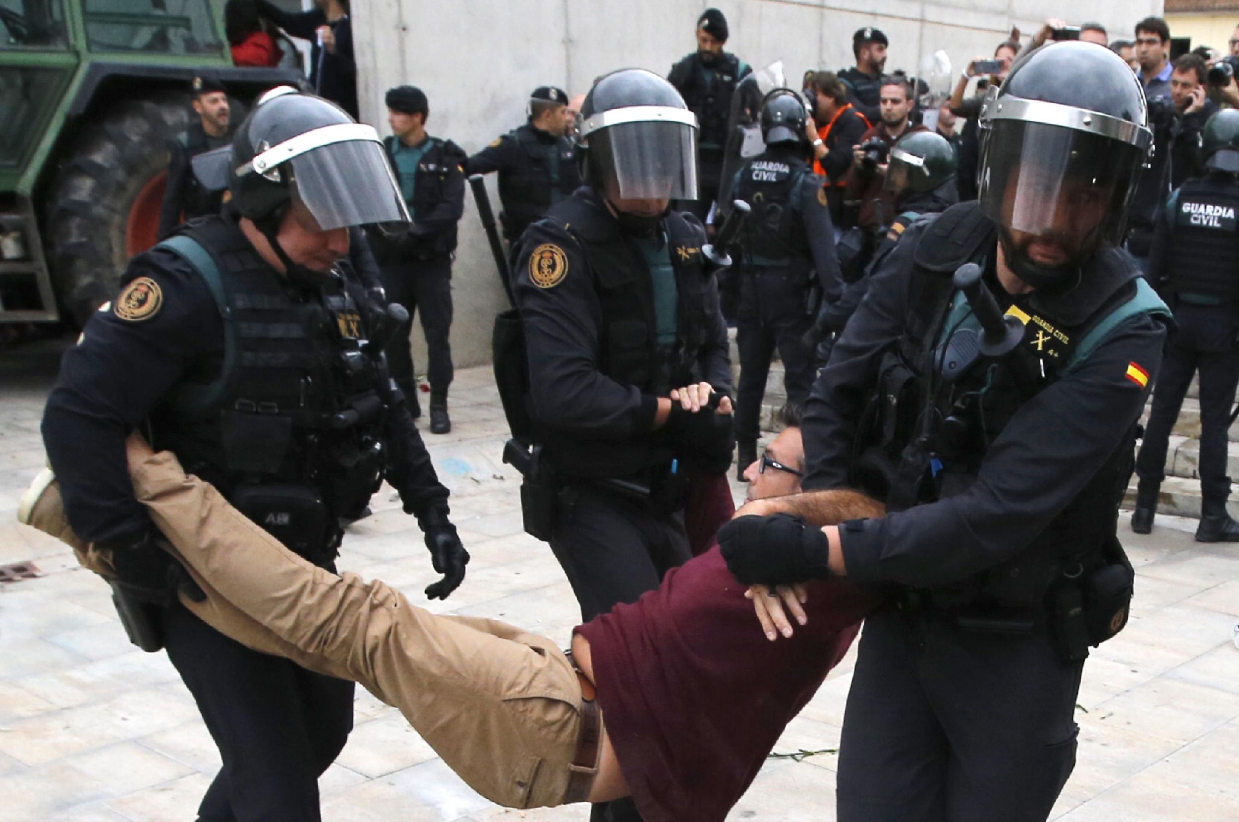 Spanish police drag man outside polling station in 2017